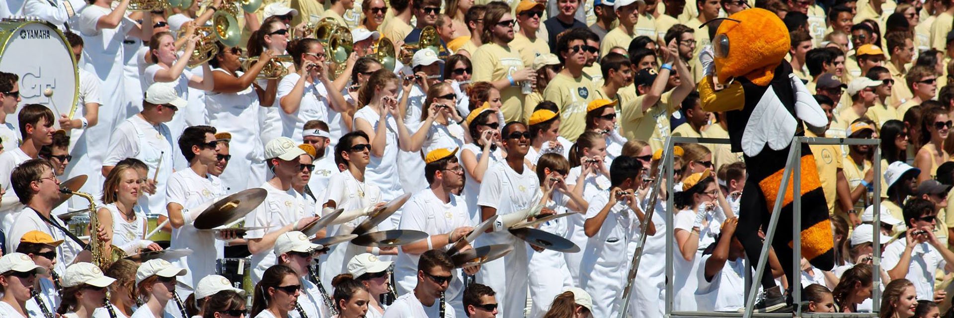 Buzz conducting marching band students at a football game.